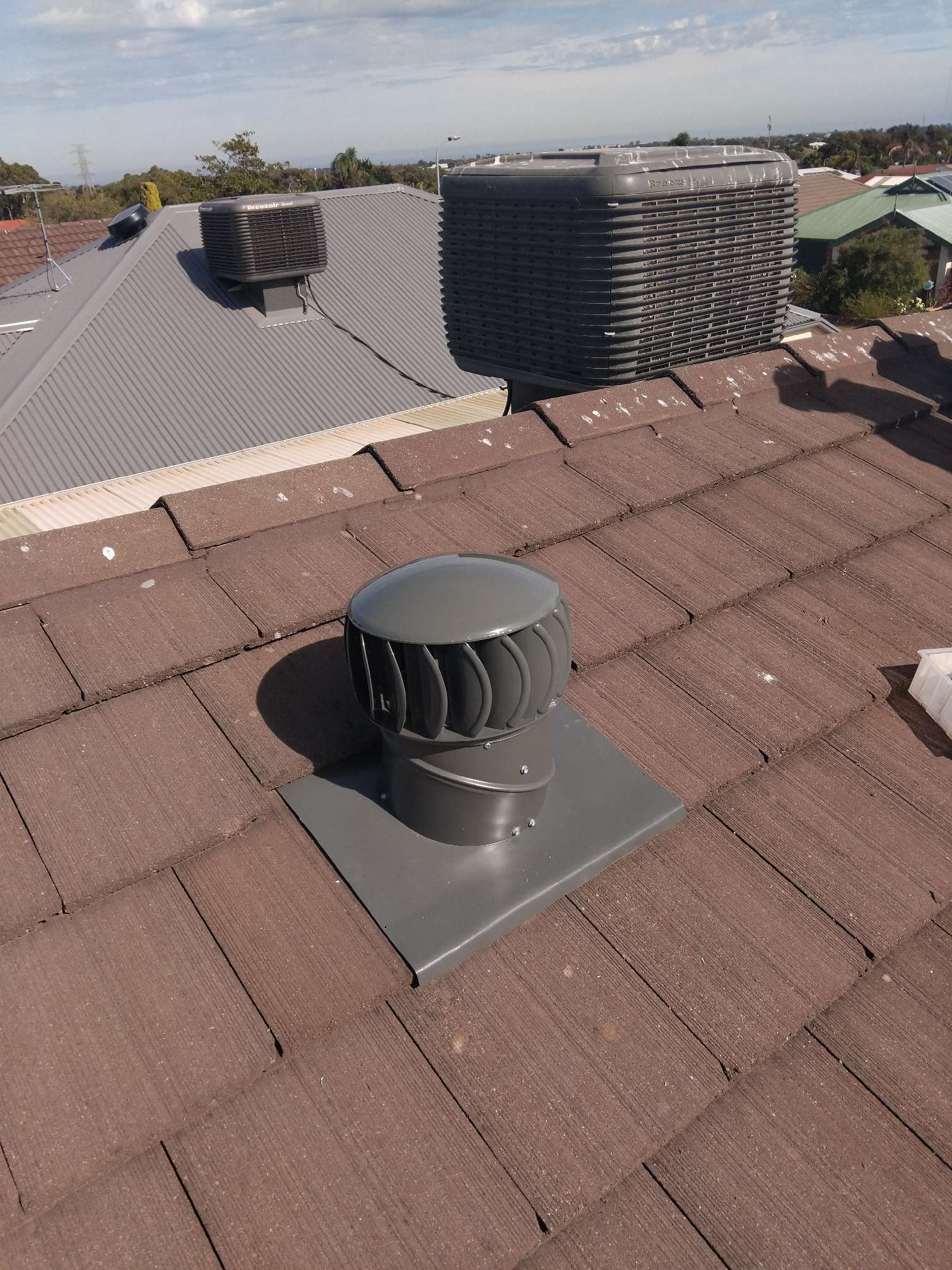 Whirlybird roof ventilation on tiled roof in Adelaide